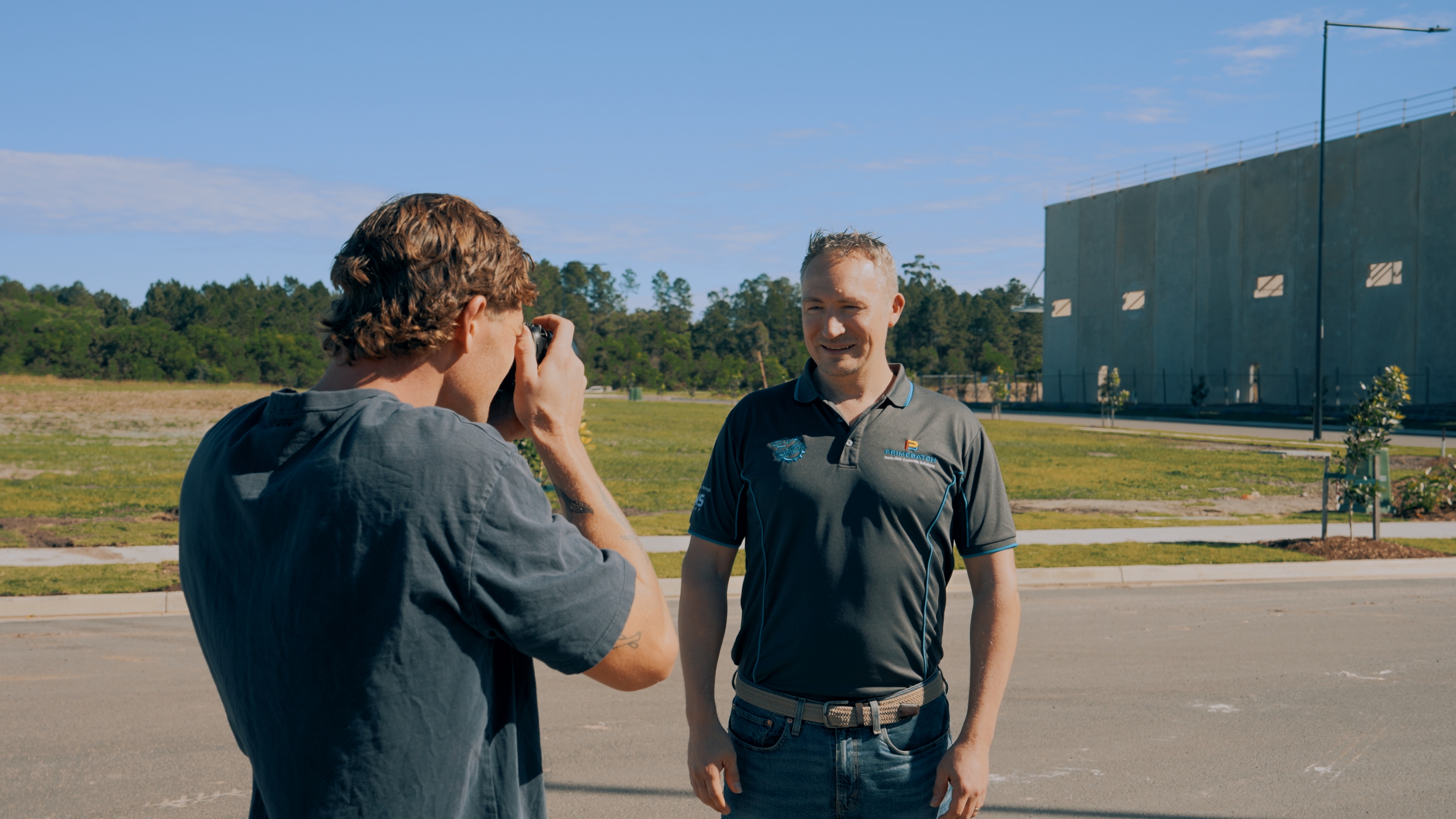 On-site photographer capturing portrait of mining crew member